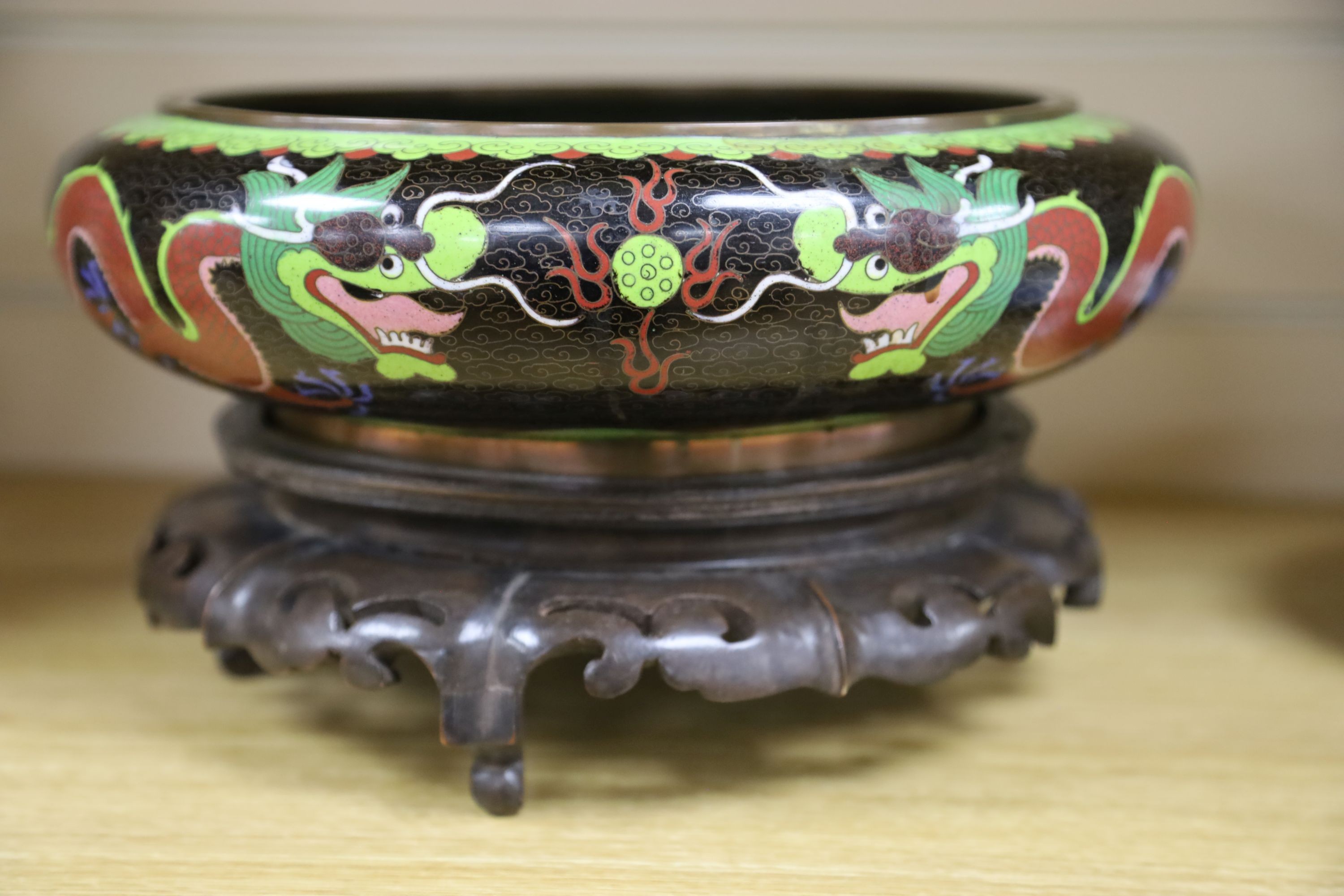 A large early 20th century Chinese cloisonné enamel ‘dragon’ bowl and two Chinese Tongzhi celadon ground famille rose bowls 31cm